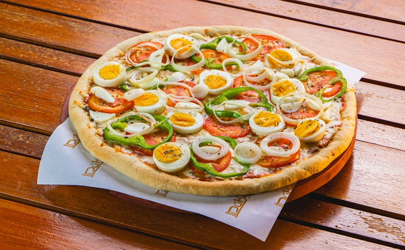 Summer garden season pizza with fresh tomatoes and herbs